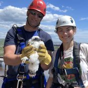 Travis Tammi and Sarah Howe at MPL Hibbard in Duluth, MN. The Richard I. Bong Memorial bridge and Lake Superior are behind them.