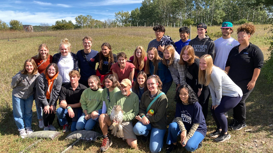 Dave Kester (green shirt, orange cap) with Jon Jenson's Environmental Philosophy class from Luther College. This class studies the philosophical response to the environmental crisis. How does philosophy reevaluate human attitudes and responsibilities toward the nonhuman environment? What are our responsibilities?