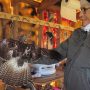 October 19, 2022: Kathy Carlyle is holding a juvenile Red-tailed hawk.