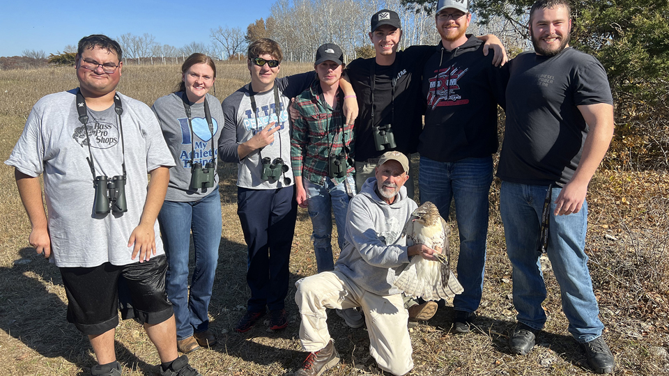 2023: Dave Kester with Luther students at the banding station on Hawk Hill in Decorah.