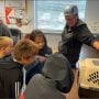Amy and children from a local school. They were very excited about the falcons! ‘Scottie’, the resident male falcon here, is from Houghton, MI: about 115 miles away as the falcon flies!